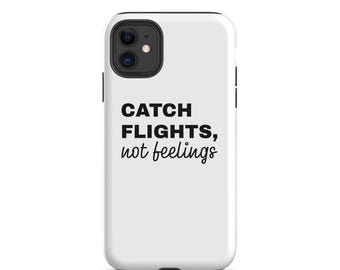 May include: A white smartphone case featuring the black text CATCH FLIGHTS, not feelings. The case has a black camera cutout area at the top left corner, designed to fit a dual-lens camera system on a mobile device.