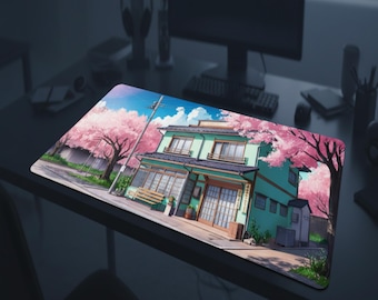May include: A rectangular mousepad featuring an anime-style illustration of a Japanese building with a green facade, cherry blossom trees, and a blue sky. The design is set on a black surface.