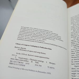 May include: Open book page with text from "A dictionary of opera and song themes" by Harold Barlow. Includes Library of Congress Cataloging in Publication Data, copyright information, and ISBN details. Printed in the United States.