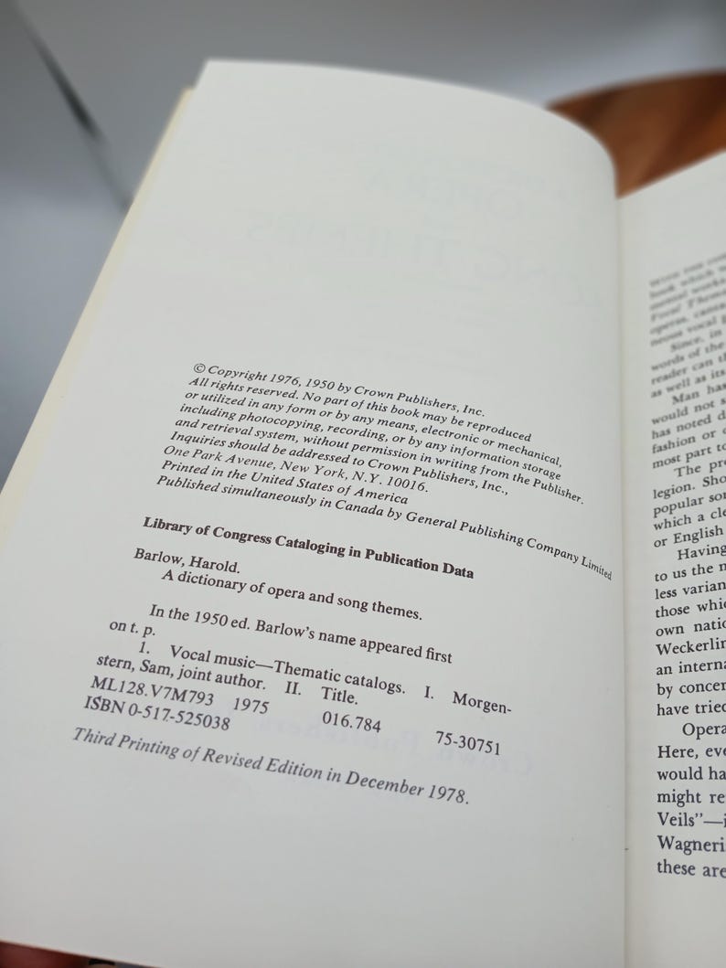 May include: Open book page with text from "A dictionary of opera and song themes" by Harold Barlow. Includes Library of Congress Cataloging in Publication Data, copyright information, and ISBN details. Printed in the United States.