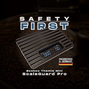 May include: A black rectangular digital scale with a ribbed surface and a central display screen showing blue digits. The text SAFETY FIRST, Bookoo Themis Mini ScaleGuard Pro, and ENGINEERED in GERMANY with a German flag icon are visible.