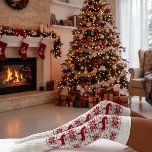 May include: Cozy Christmas scene featuring a decorated tree with ornaments and lights. A fireplace with stockings and a wreath adds to the festive atmosphere. White and red patterned knee-high socks with reindeer and snowflake designs.