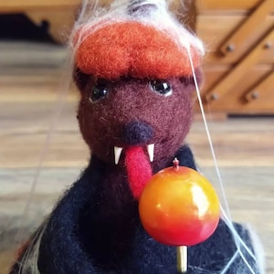 Needle felted Bat with candy apple in a pumpkin
