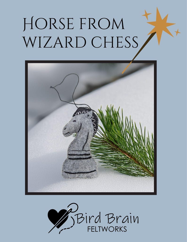 May include: A gray felt horse chess piece with black detailing, from a Wizard Chess set. The horse is displayed on a snowy surface with a sprig of green pine needles. The text "HORSE FROM WIZARD CHESS" is at the top.