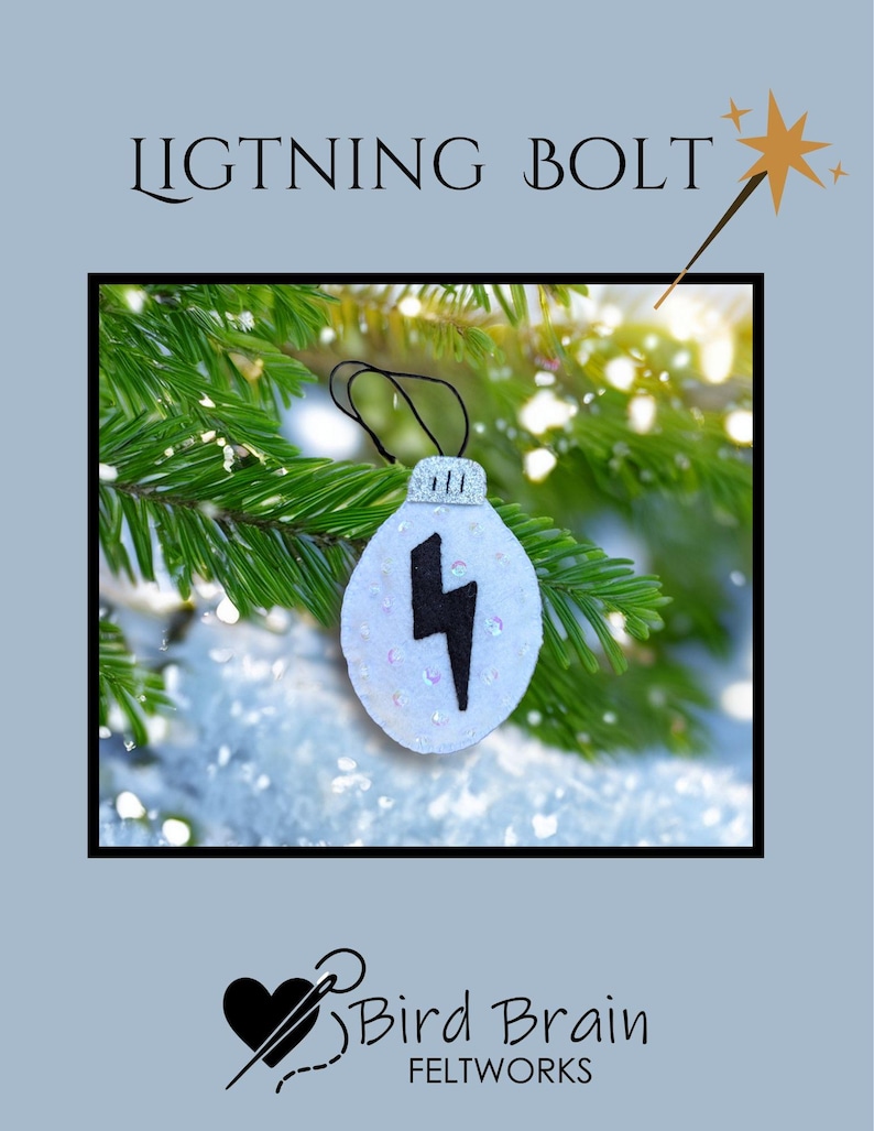 May include: A white felt ornament with a black lightning bolt design. The ornament is embellished with sequins and has a silver cap. The text "LIGHTNING BOLT" is above the ornament. The background features evergreen branches and snow.