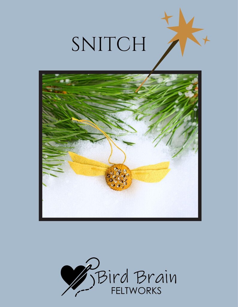 May include: A handmade felt Snitch ornament with yellow wings and a gold sequined body. The ornament is set against a snowy background with pine branches and the text "SNITCH". The Bird Brain Feltworks logo is at the bottom.