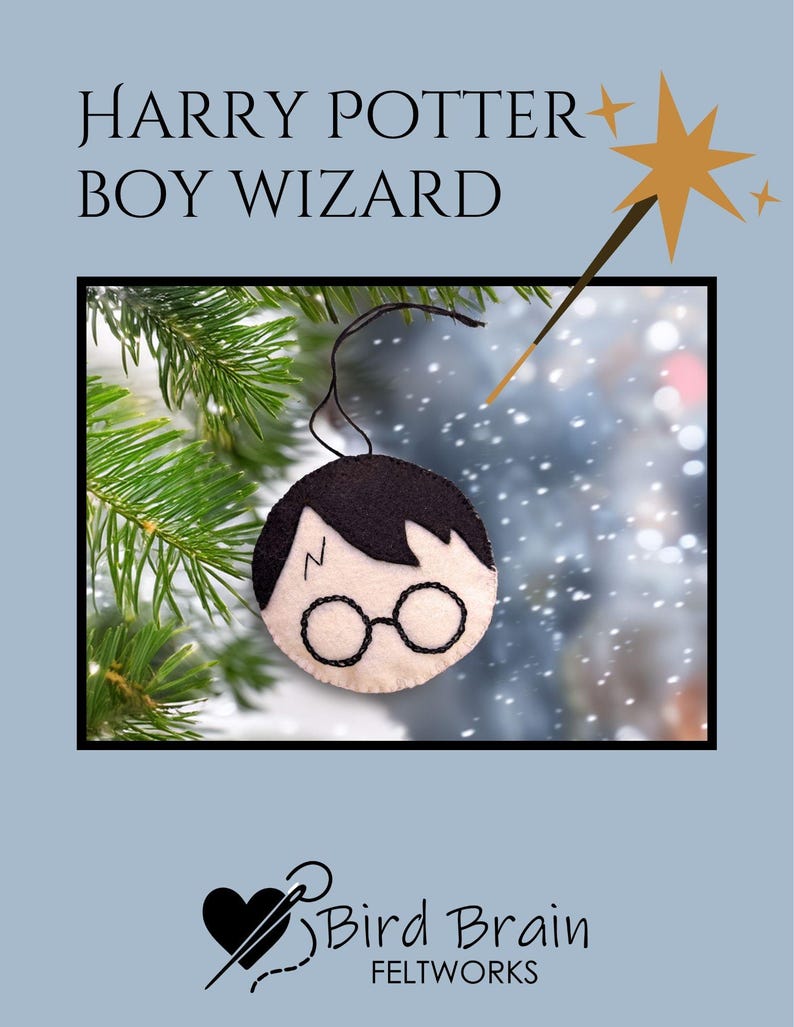 May include: A felt ornament featuring a boy wizard design with black hair, glasses, and a lightning bolt scar. The ornament is hanging from a black string. The text "HARRY POTTER BOY WIZARD" is at the top. The Bird Brain Feltworks logo is at the bottom.