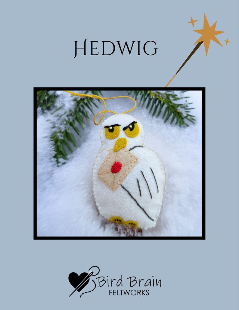 May include: A felt owl ornament with the name "HEDWIG" above it. The white owl holds a tan envelope with a red seal. The owl has yellow eyes and feet. The background is light blue with a star and a wand.