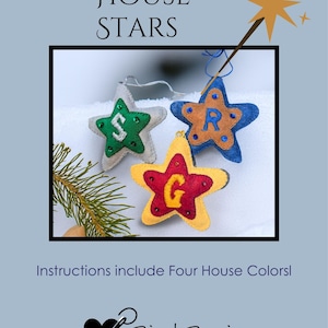 May include: Three felt star ornaments in green, blue, and yellow, each with a letter and decorative accents. The image includes the text "HOUSE STARS" and "Instructions include Four House Colors!" on a light blue background. The Bird Brain Feltworks logo is at the bottom.