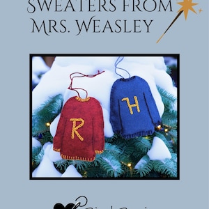 May include: Two felt sweater ornaments, one red with a yellow "R" and one blue with a yellow "H", are displayed against a snowy backdrop. The text "SWEATERS FROM MRS. WEASLEY" is at the top. The Bird Brain Feltworks logo is at the bottom.