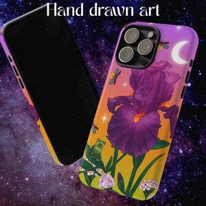 May include: A phone case with a vibrant floral design featuring a large purple iris, a crescent moon, and a frog. The case has a gradient background of yellow, orange, and purple, with the text "Hand drawn art".