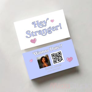 May include: Two business cards with text and graphics. The top card reads "Hey Stranger!" in light blue script with pink hearts. The bottom card says "Wanna Date?" with a photo, QR code, and contact info.