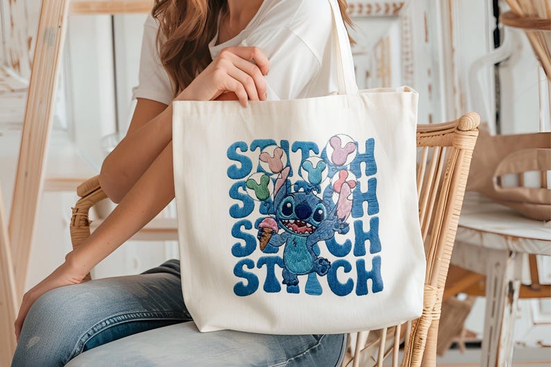 May include: Cream-colored tote bag featuring a blue cartoon character holding ice cream and balloons, with the word "Stitch" in blue block letters. The bag is made of a sturdy fabric and has a simple design.