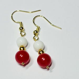 Red/white jade gemstone dangle earrings with gold accents
