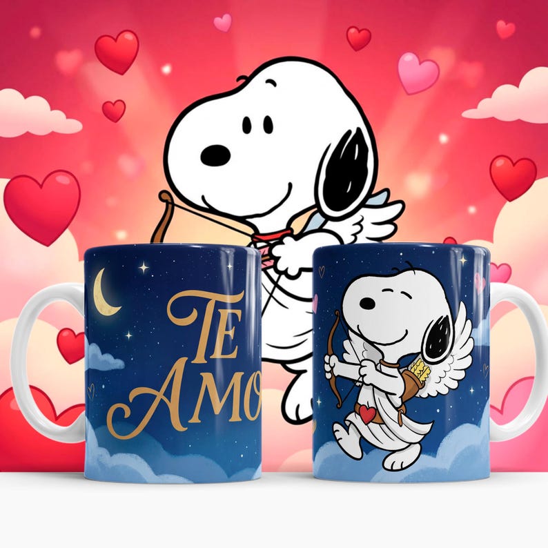 May include: Two ceramic mugs with a Snoopy design. One mug has the words "Te Amo" in gold lettering against a dark blue starry sky background. The other mug features Snoopy as Cupid with a bow and arrow, set against a similar background.