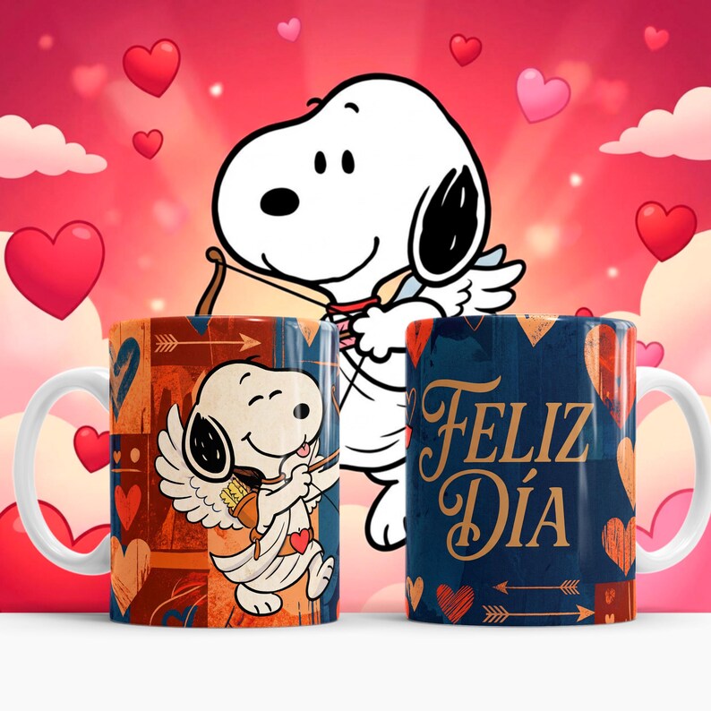 May include: Two ceramic mugs featuring Snoopy as Cupid with a bow and arrow, set against a pink and red heart-filled background. One mug has the text "Feliz D&iacute;a" in gold. The mugs have white handles and are decorated with hearts and arrows.