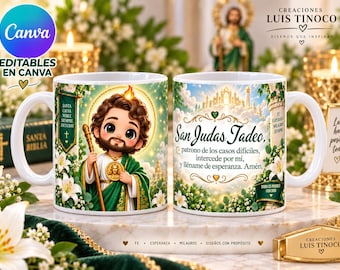 May include: Two white ceramic mugs featuring a cartoon illustration of Saint Jude Thaddeus in green robes with a golden staff and halo. The mugs display Spanish text including 'San Judas Tadeo, patrono de los casos difíciles' and floral accents.
