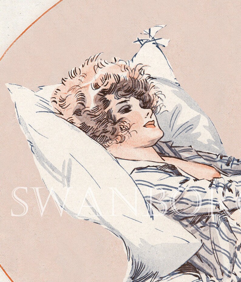 May include: A woman with curly brown hair lies on a white pillow wearing a light blue and white striped shirt. The background is a light pink colour.