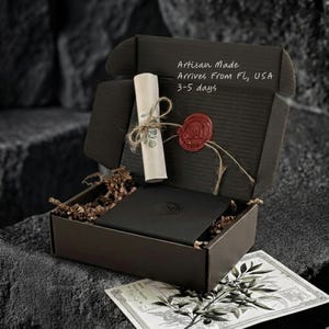 Christian jewelry gift for him presented in branded box, st michael pendant with gold plated wings and wheat chain, ready for gifting as meaningful catholic jewelry.