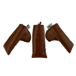 May include: Three brown leather golf club head covers. Each cover has a tag with a logo. The covers are made of a smooth, textured leather and are designed to protect golf clubs.