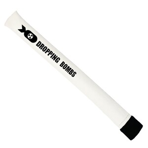 May include: White foam novelty item with the text "DROPPING BOMBS" and a black bomb graphic. The item has a black end cap and is cylindrical in shape. The item is designed to be held.