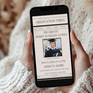 May include: A smartphone displays a graduation announcement. The headline reads "GRADUATION TIMES" with the text "HE DID IT! JERRY IS GRADUATING!" A photo of the graduate is in the center. The invitation includes the date, time, and location.