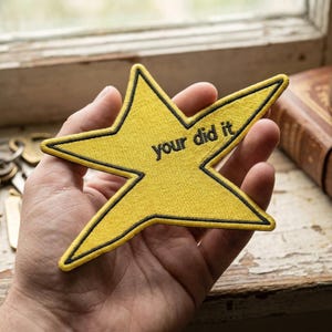 May include: A set of three ceramic nesting bowls in shades of blue, green, and white. The bowls feature a speckled glaze and a simple, modern design. The largest bowl measures approximately 6 inches in diameter.