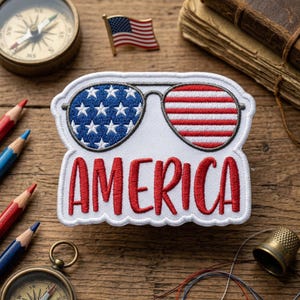 May include: A white ceramic mug with a black handle and the text "But First, Coffee" in a bold, black font. The mug is filled with a dark liquid, likely coffee, and sits on a light-colored surface.