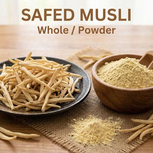 May include: Image of Safed Musli, whole and powder form. A dark plate holds whole Safed Musli, while a wooden bowl contains the powder. A wooden scoop rests in the bowl. The text "SAFED MUSLI Whole / Powder" is at the top.