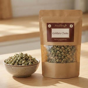 May include: A package of Gokru Chota, a pure Ayurvedic wellness product, and a small bowl filled with the same product. The package is brown with a clear window, and the bowl is a light beige color. The text "NatureSpring" is visible on the package.