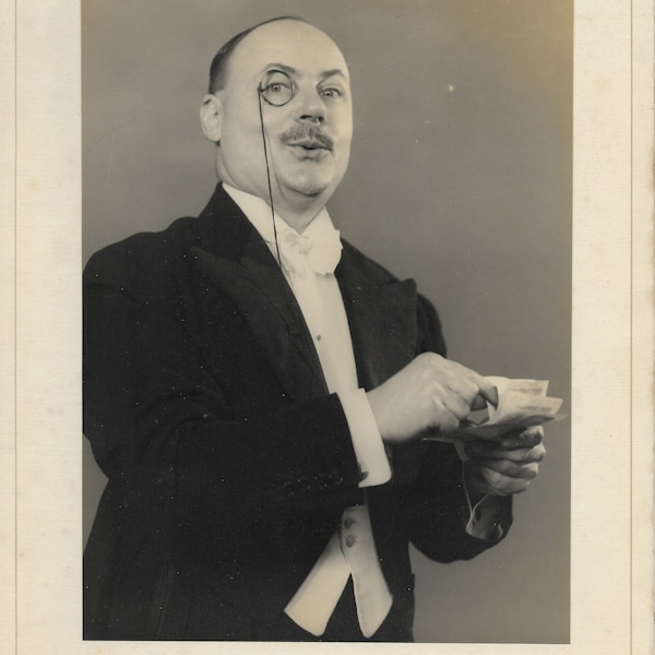 Theatrical publicity photograph of local actor W. Hudson, Rochdale, in dinner suit and monocle.