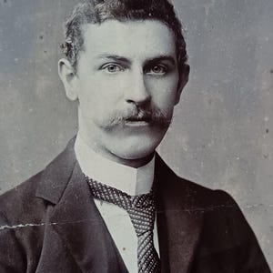 Cabinet card (damaged) of a handsome gent