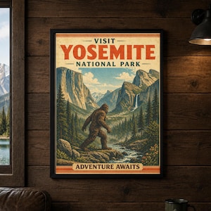 May include: Framed vintage-style poster with the text "VISIT YOSEMITE NATIONAL PARK" in red and white. The artwork depicts a Bigfoot-like creature walking through a river in a mountain landscape. The bottom of the poster reads "ADVENTURE AWAITS."