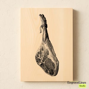 May include: A sepia-toned print of a cured ham leg, hanging from a wooden board. The ham is detailed with visible marbling and a tied band at the top. The wooden board has a light wood grain. The text "EngraveLines Studio" is in the bottom right corner.