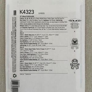 May include: A white pattern envelope for K4323 Plush Aliens, 18" (46cm) tall. The package includes instructions and fabric requirements for making three different alien plush toys. The package also shows illustrations of the finished plush toys.