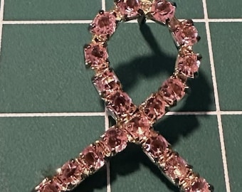 Breast Cancer Awareness Pink Rhinestone Silver Tone Lapel Pin It comes in a box.