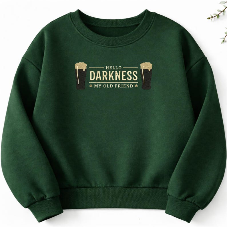 May include: A dark green sweatshirt with the text "HELLO DARKNESS MY OLD FRIEND" in white. The design includes two black beer glasses with foamy tops. The sweatshirt is a crew neck style.