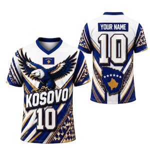 May include: A white, blue, and gold sports jersey featuring a large eagle graphic, the text KOSOVO, and the number 10 on the front. The back displays the text YOUR NAME, the number 10, and a map of Kosovo with stars in a blue and gold color scheme.