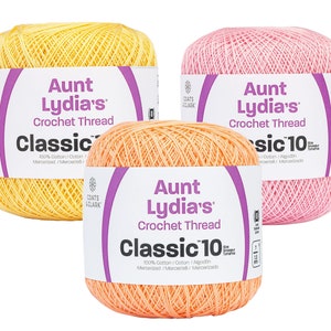 May include: Three balls of Aunt Lydia's Classic Crochet Thread in yellow, pink, and orange. The thread is 100% cotton and mercerized.