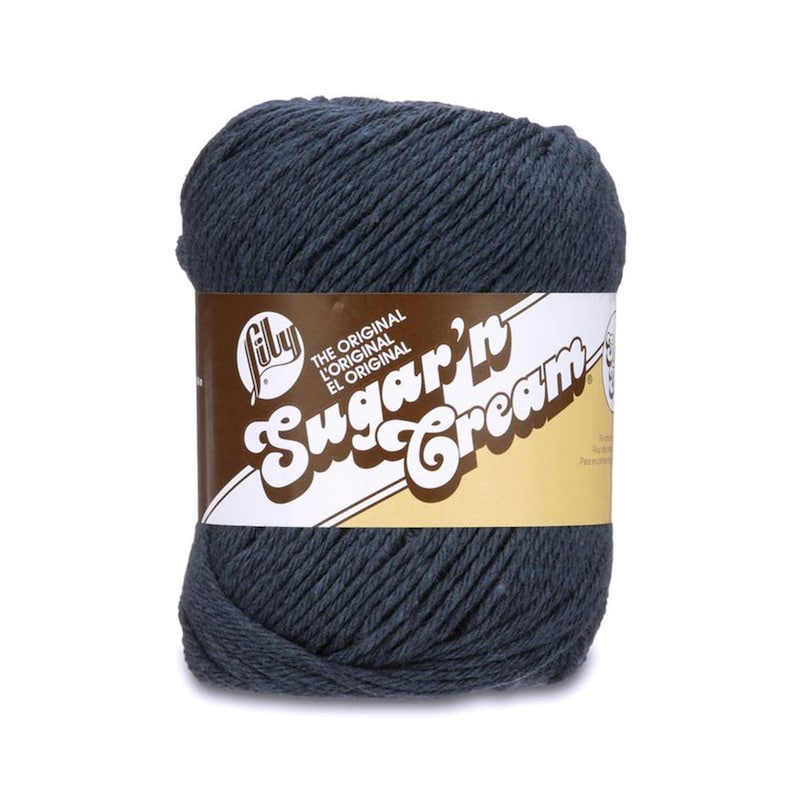 May include: A skein of dark blue yarn labeled "The Original L'Original El Original Sugar'n Cream" by Lily.