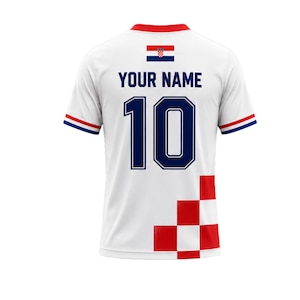 May include: White soccer jersey with the Croatian flag and the text "YOUR NAME" above the number 10 in navy blue. The jersey has red and blue accents on the sleeves and collar.