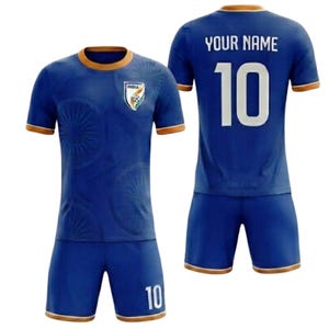 May include: A blue football kit with gold trim, displaying the India national team emblem. The shirt has the number 10 on the front and back, with "YOUR NAME" above the number on the back. The shorts are also blue with gold detailing.
