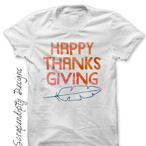 May include: White t-shirt with the text "HAPPY THANKSGIVING" in orange, red, and yellow watercolour lettering. A stylised feather is below the text.