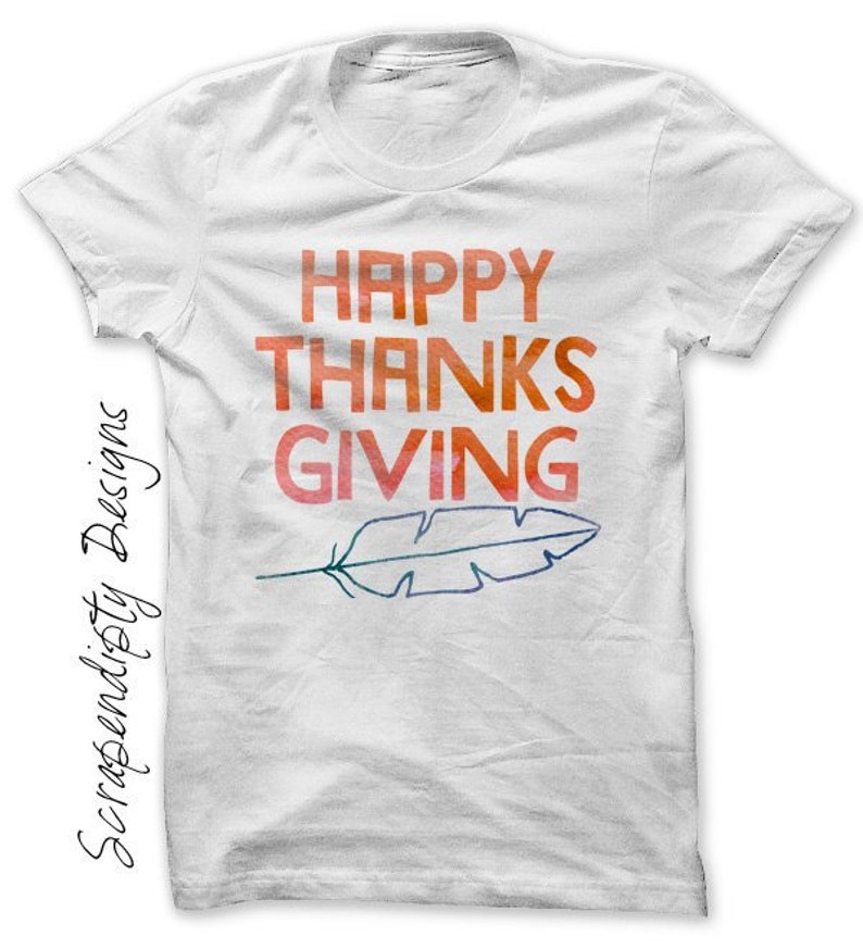May include: White t-shirt with the text "HAPPY THANKSGIVING" in orange, red, and yellow watercolour lettering. A stylised feather is below the text.