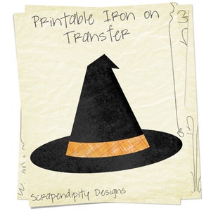 May include: Printable iron-on transfer design of a black witch hat with an orange band. The design is on a cream-colored background with the text "Printable Iron on Transfer" and "Scrapendipity Designs".