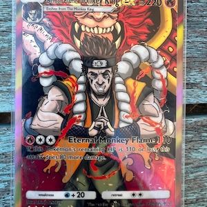 May include: A holographic trading card featuring the "Demon Flame Monkey King ex." The card displays a detailed illustration of a character with flames and text that reads "Eternal Monkey Flame 110." The card has a HP of 220.