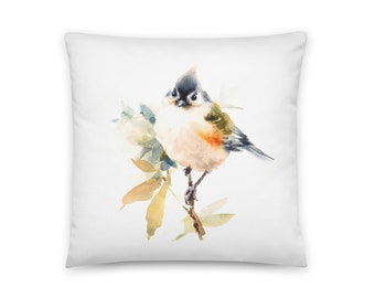 May include: A watercolor painting of a small bird perched on a branch with leaves. The bird is brown, white, and blue with a long tail. The leaves are green and yellow.