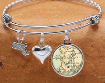 May include: A silver charm bracelet with three charms: a heart, a state of Massachusetts outline, and a vintage map of Falmouth, Massachusetts.
