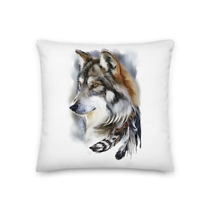 May include: A watercolor painting of a wolf's head with a brown, gray, and white fur pattern. The wolf is looking to the side and has a few feathers around its neck.