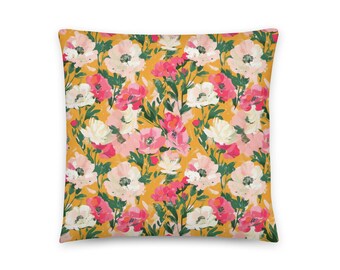 May include: A yellow throw pillow with a floral pattern featuring pink, white, and green flowers. The pillow is made of a soft, comfortable fabric and is perfect for adding a touch of color and style to any room.